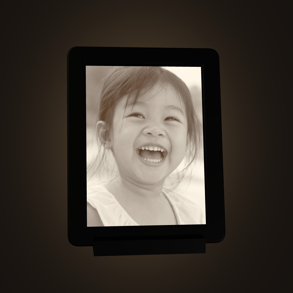 A child laughing, lit