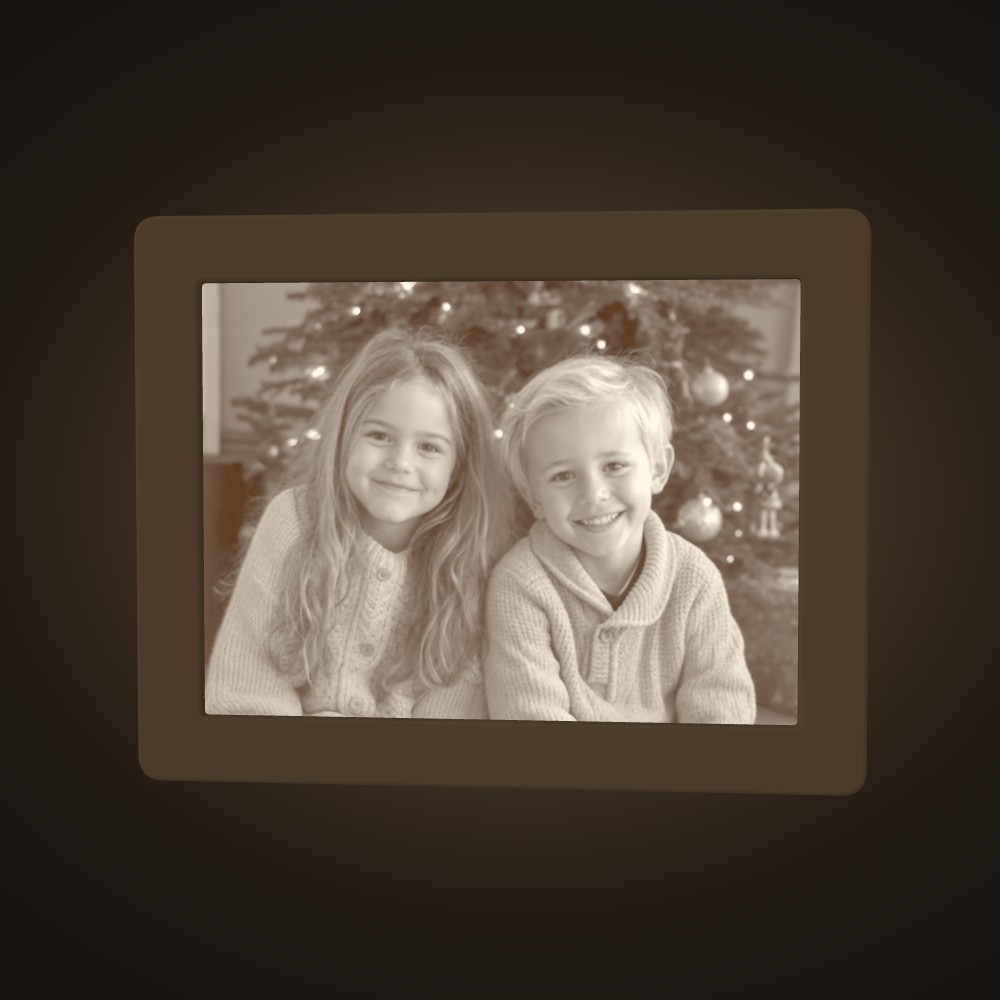 Two children at Christmas, lit